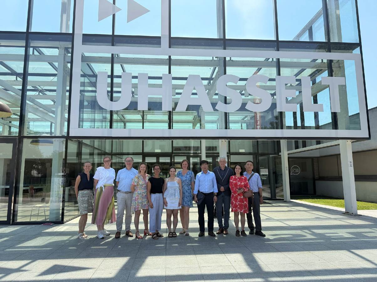 A group of people standing in front of a building

AI-generated content may be incorrect.